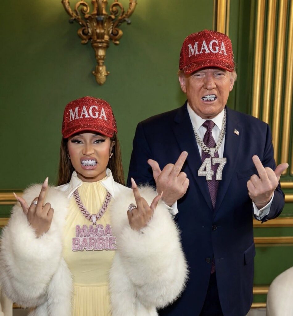Two people wearing MAGA caps showing middle fingers