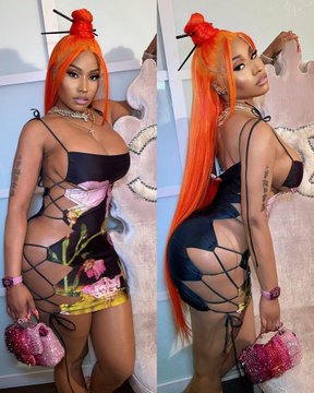 Woman with bright orange hair wearing lace-up dress